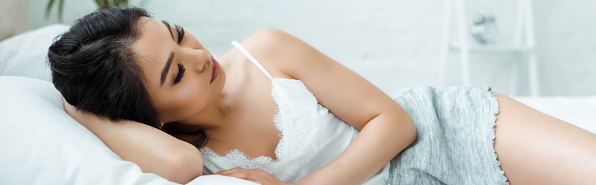 Thai girl lying on bed
